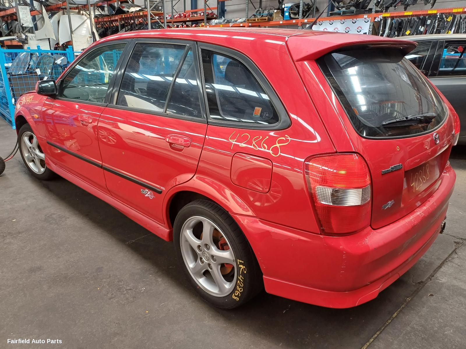 2001 Mazda 323 Washer Bottle